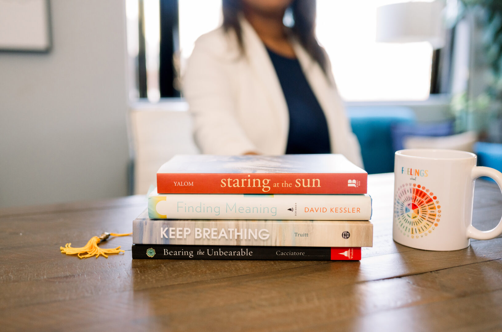 close up photo of books about dealing with grief, taken by Temecula personal brand photographer