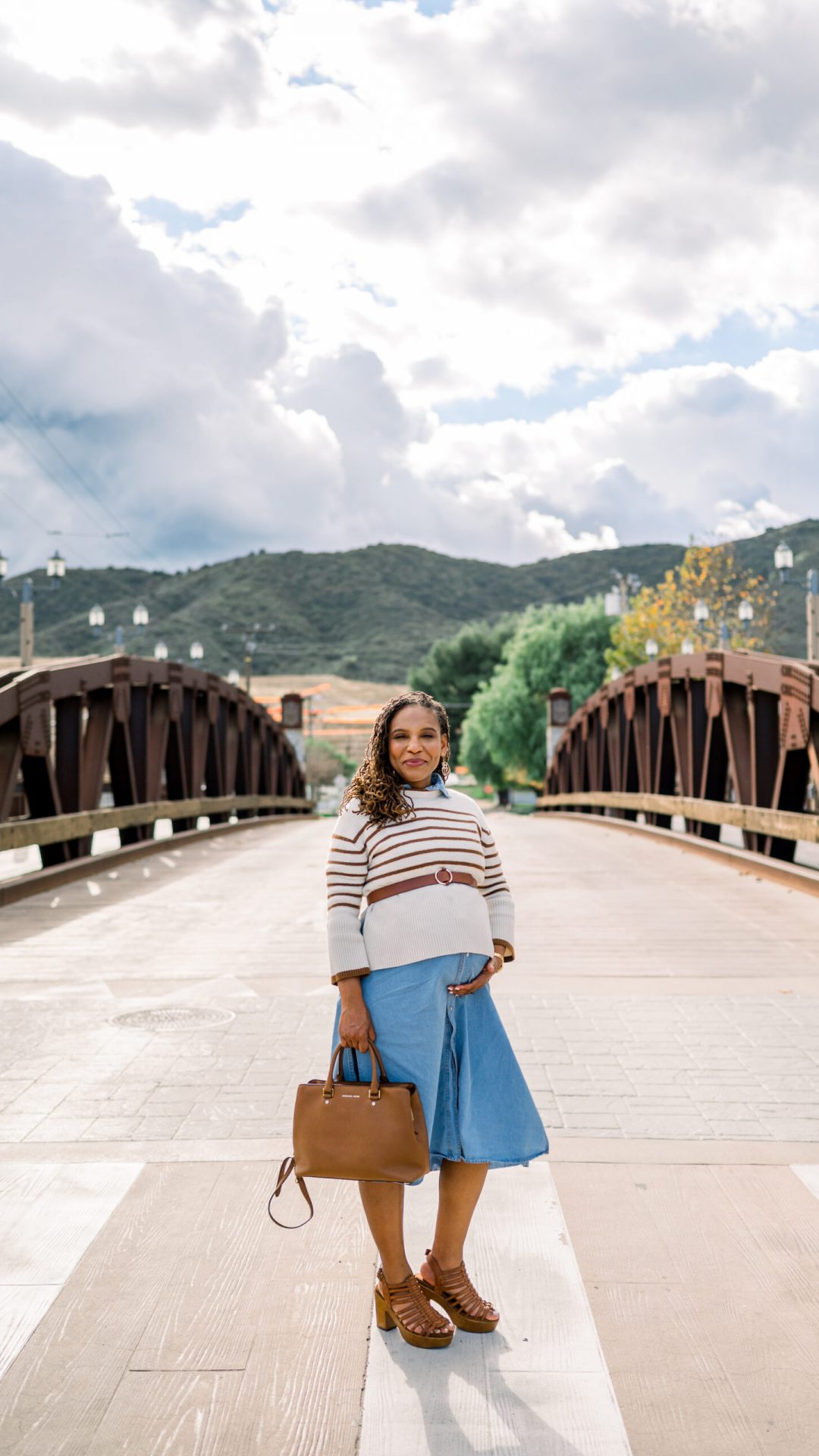 Realtor posing on Old Town Bridge in Temecula during a brand session.