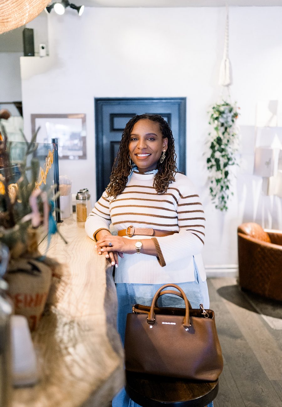 Person standing at a café counter.