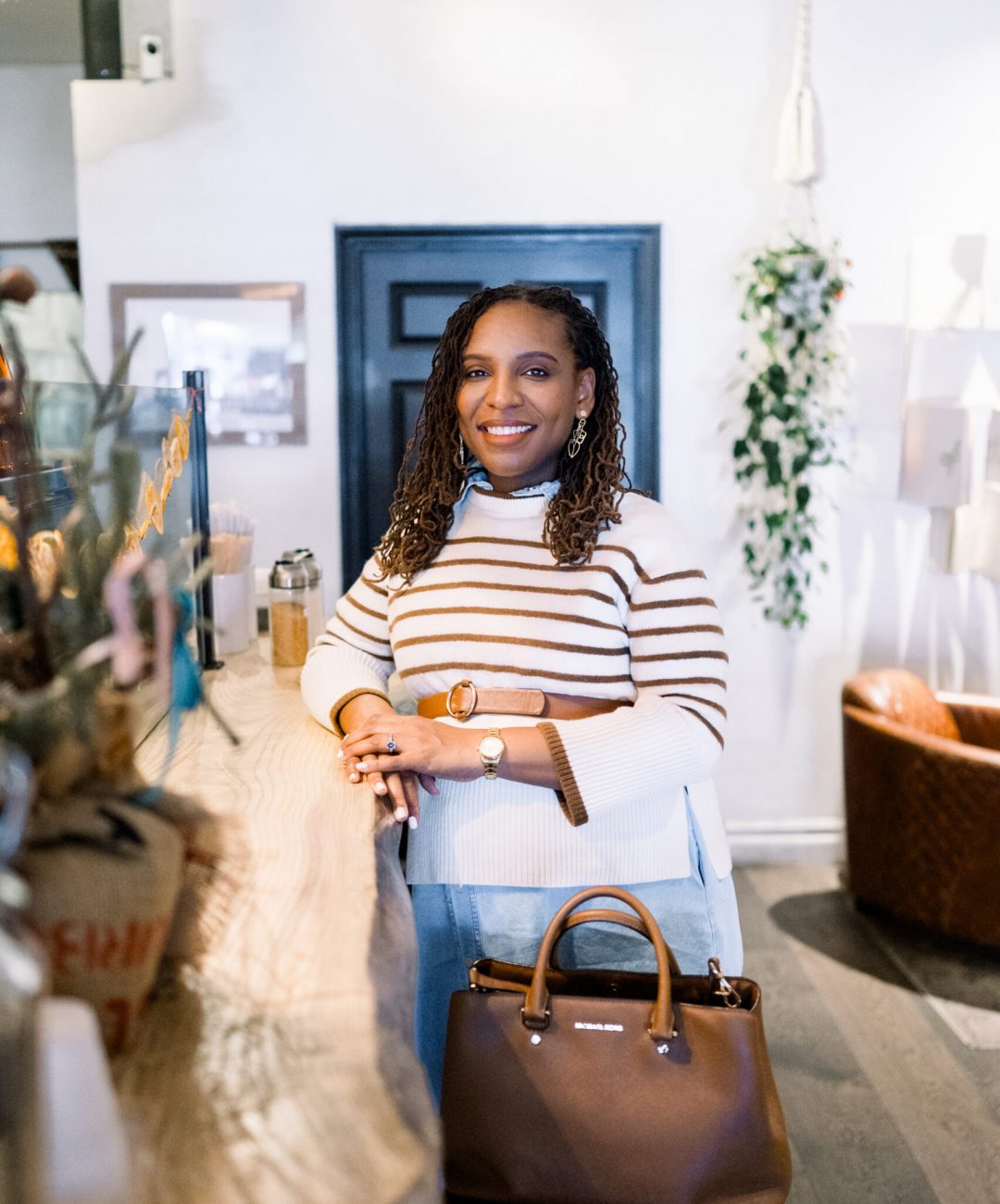 A realtor in a coffee shop in old town Temecula during a brand session