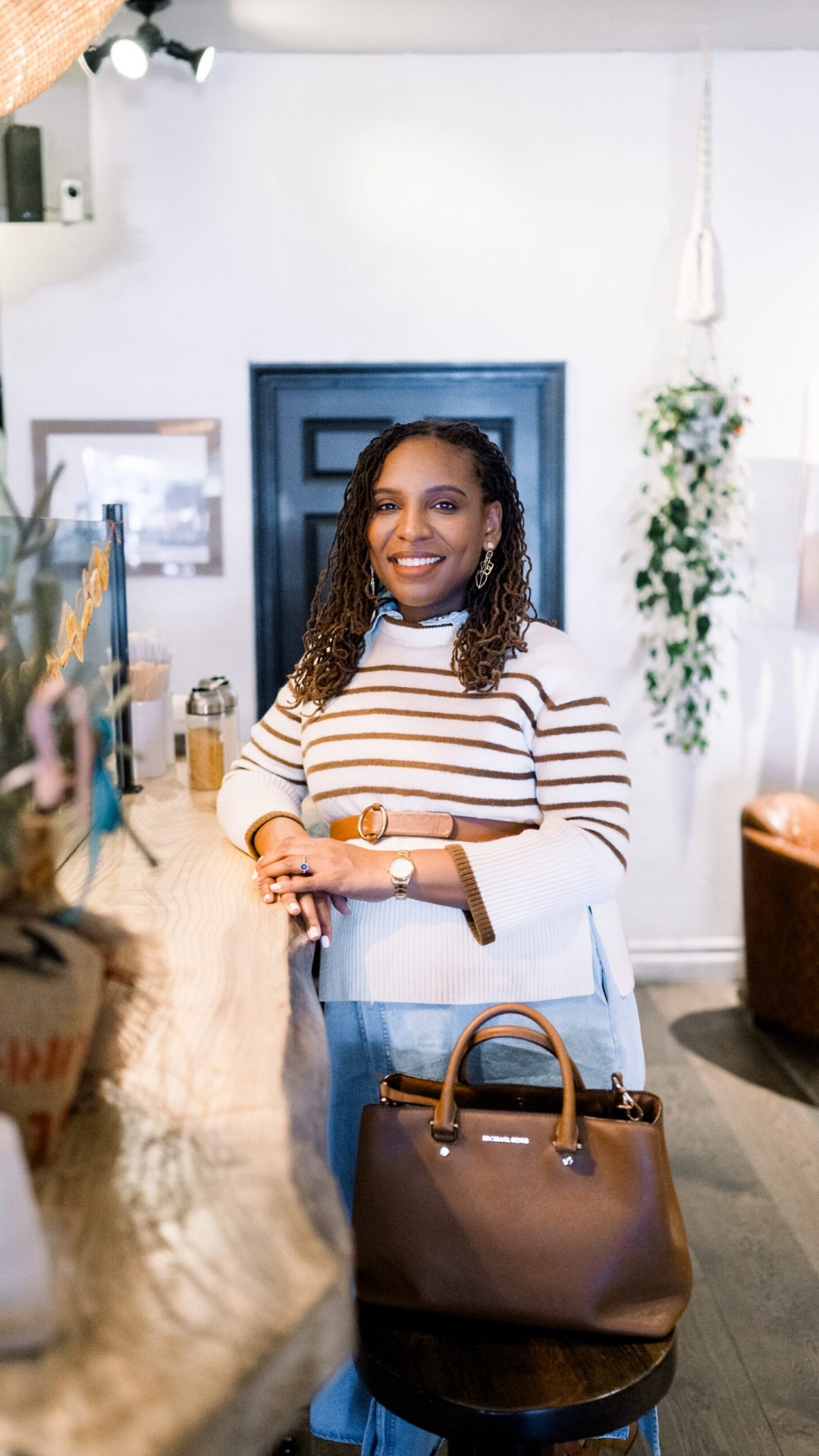 A realtor in a coffee shop in old town Temecula during a brand session