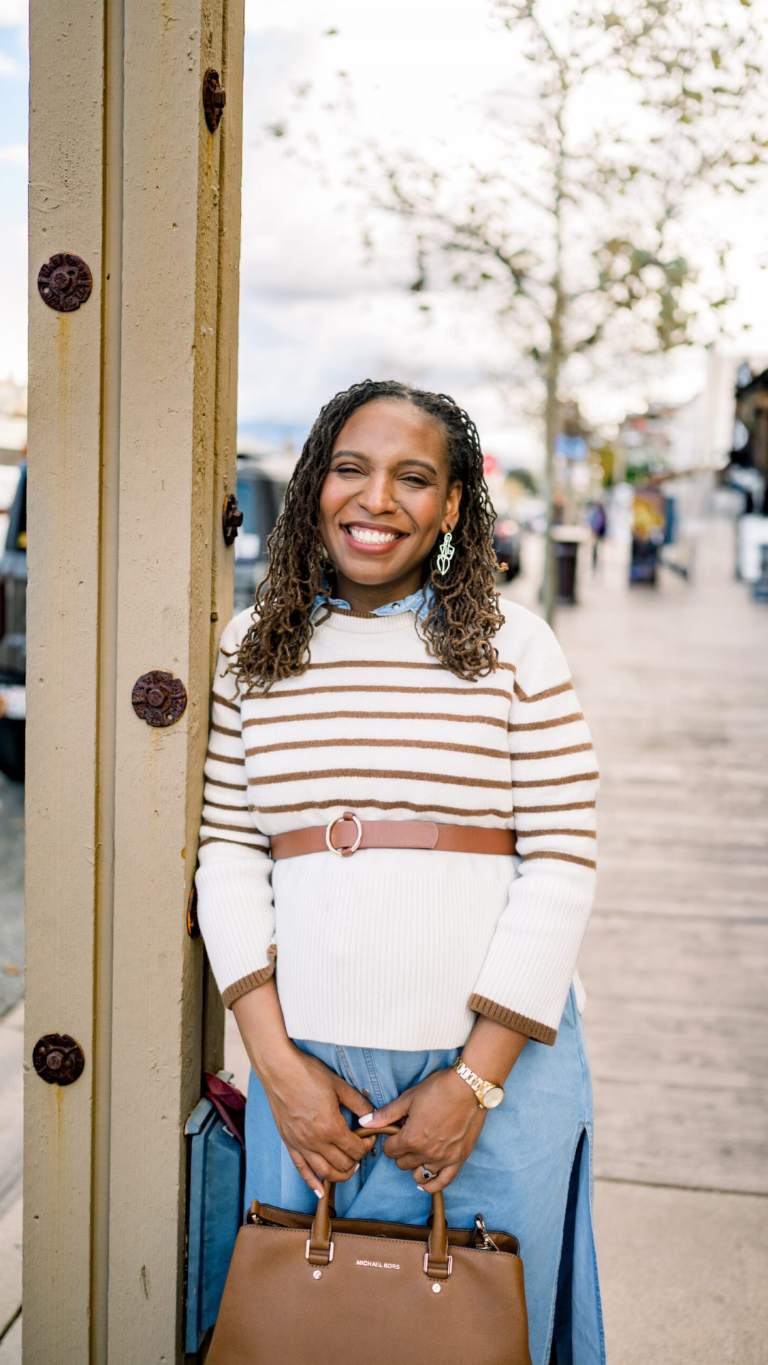 realtor posing on the sidewalk in old town Temecula during a brand photo session